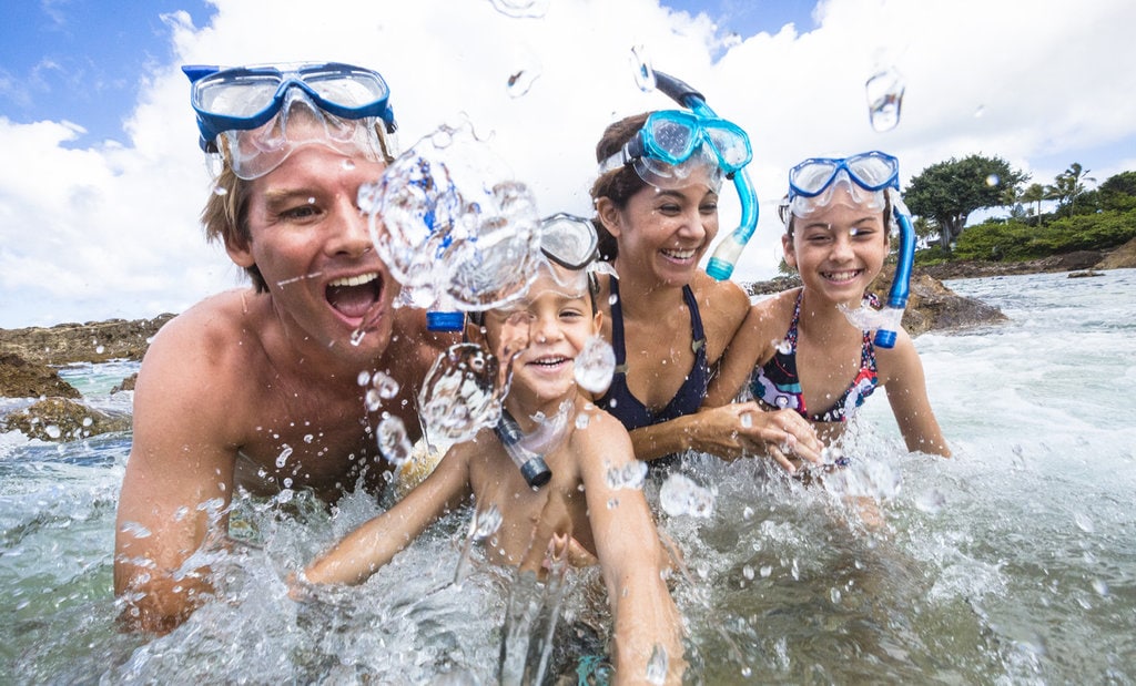 a family having fun in the sea